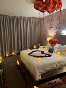 Bed with photo frames and candles